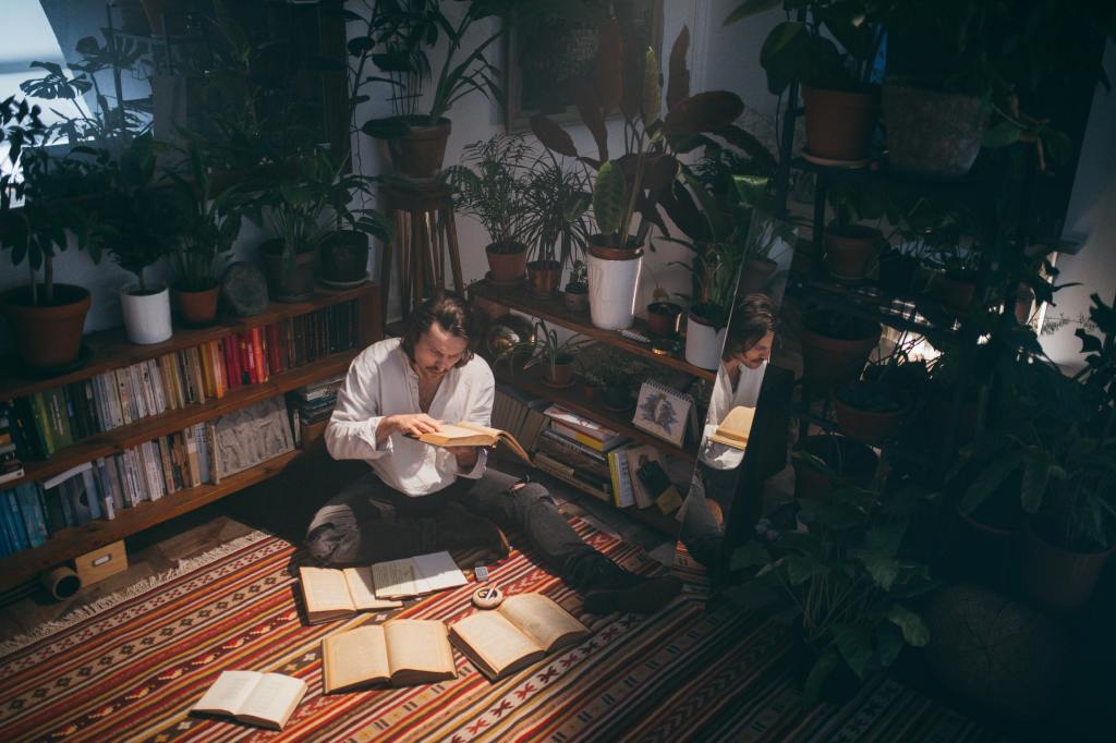 Reader enraptured in a pile of books