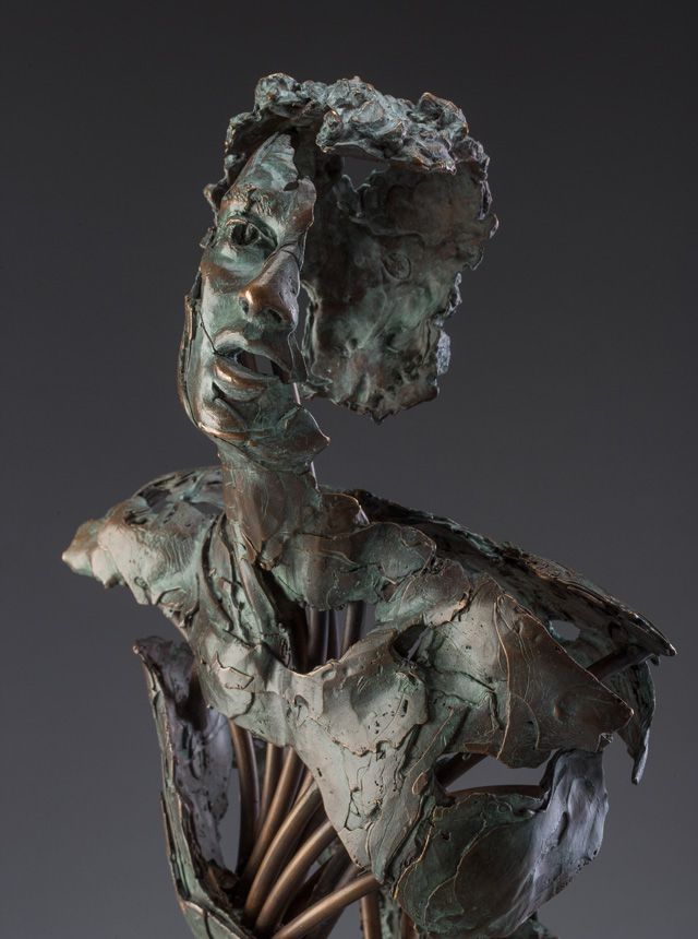 A haunting statue of a female form partly hollow