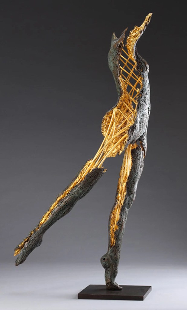 A haunting statue of a female form partly hollow