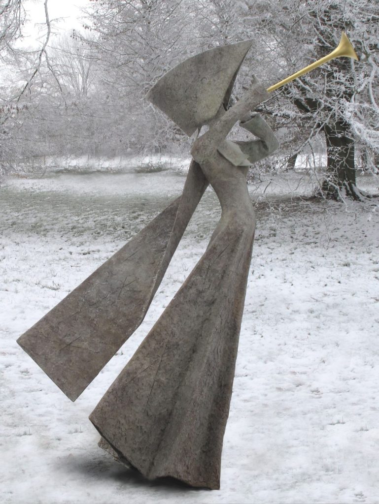 A statue of a nun blowing a trumpet